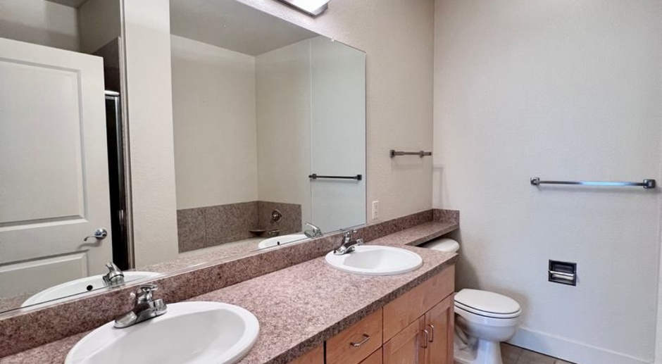 Modern and stylish 2/2.5 townhome w/ washer & dryer and 2 parking spots included!
