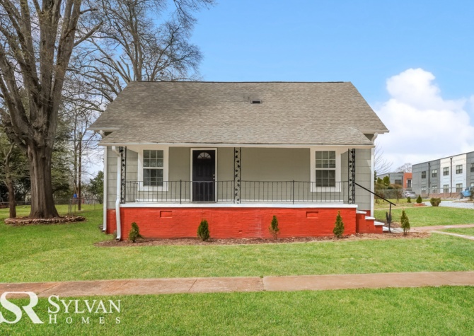 Houses Near Charming 4BR 3BA home features a traditional rocking chair front porch